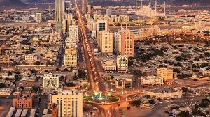 Fujairah City on the UAE east coast featuring mountains, modern buildings, beaches, ports and cultural landmarks.